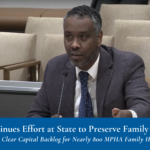 A man speaks into a microphone at a Minnesota State Senate hearing.