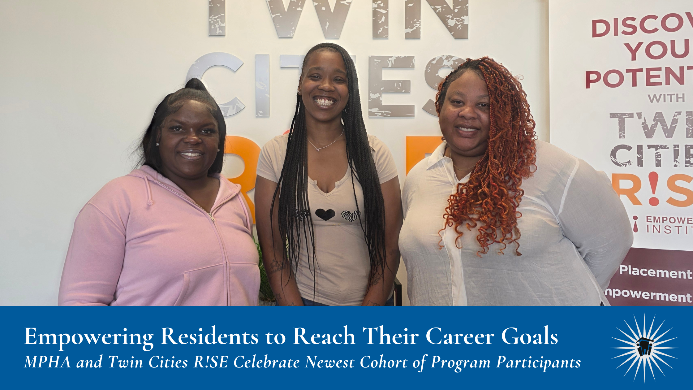 Three women stand and smile in front of a "Twin Cities RISE" sign and a banner with program information in an indoor setting.