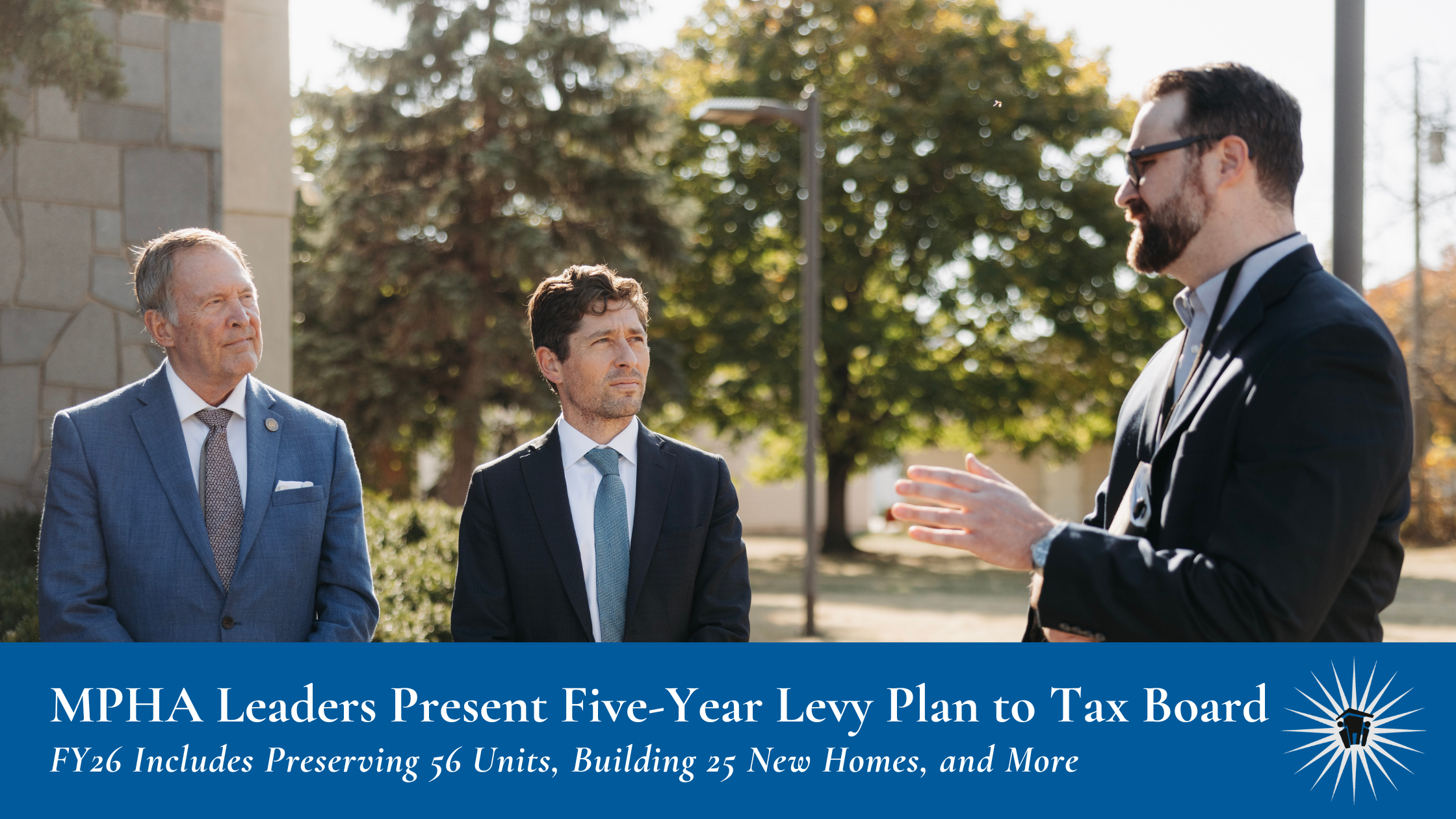 Three men in suits stand outside on a sunny day, engaged in conversation, with trees and a building in the background. Text banner at bottom reads: MPHA Leaders Present Five-Year Levy Plan to Tax Board; FY26 Includes Preserving 56 Units, Building 25 New Homes, and More