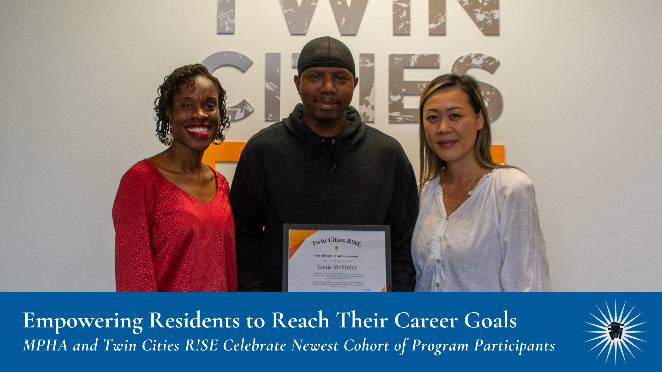 Three people stand indoors, with the person in the center holding a framed certificate. The background features a wall with the words "TWIN CITIES" partially visible.