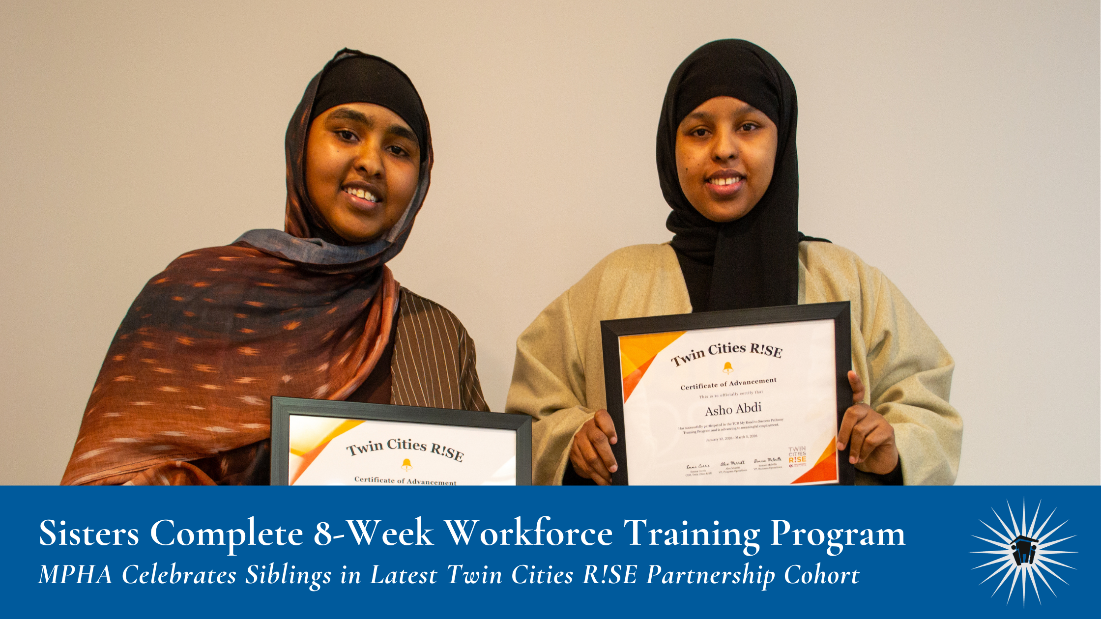 Two women stand side by side, smiling and holding certificates of achievement for completing an 8-week workforce training program.