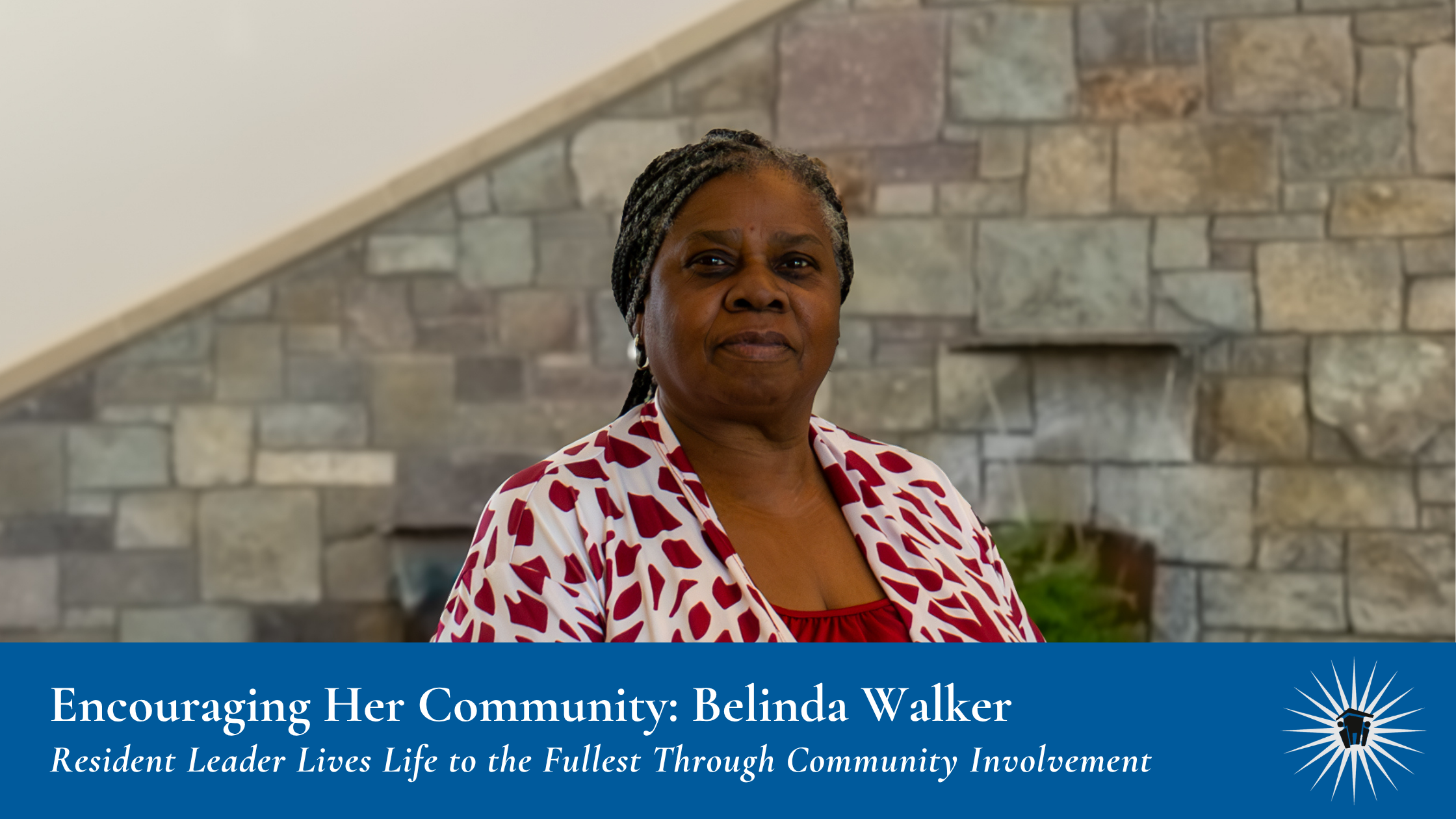 A woman stands indoors in front of a stone wall, wearing a red and white top. A blue banner at the bottom reads, "Encouraging Her Community: Belinda Walker"