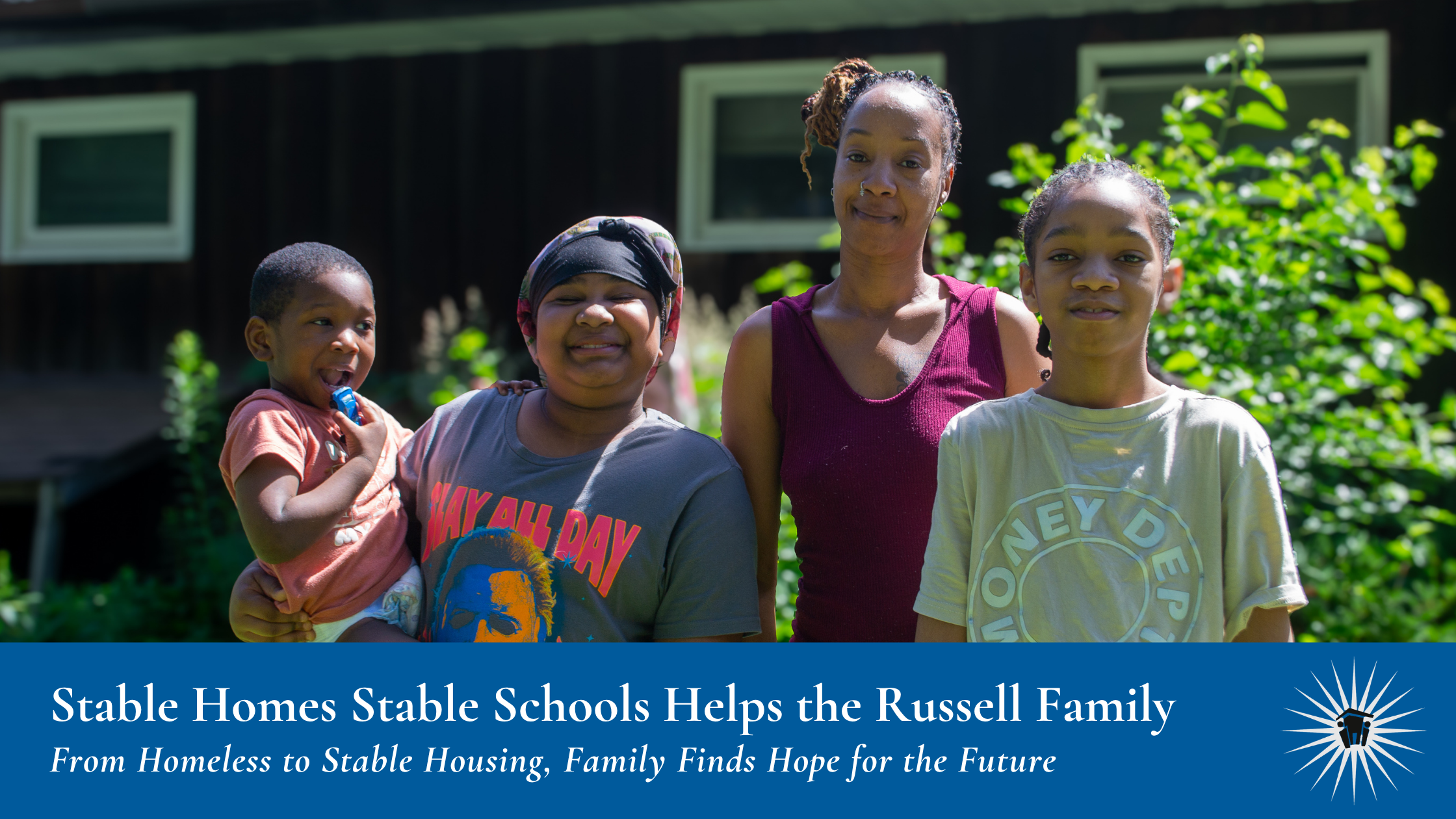 A woman and three children stand outside in front of a house, smiling at the camera. The caption highlights support received for stable housing.