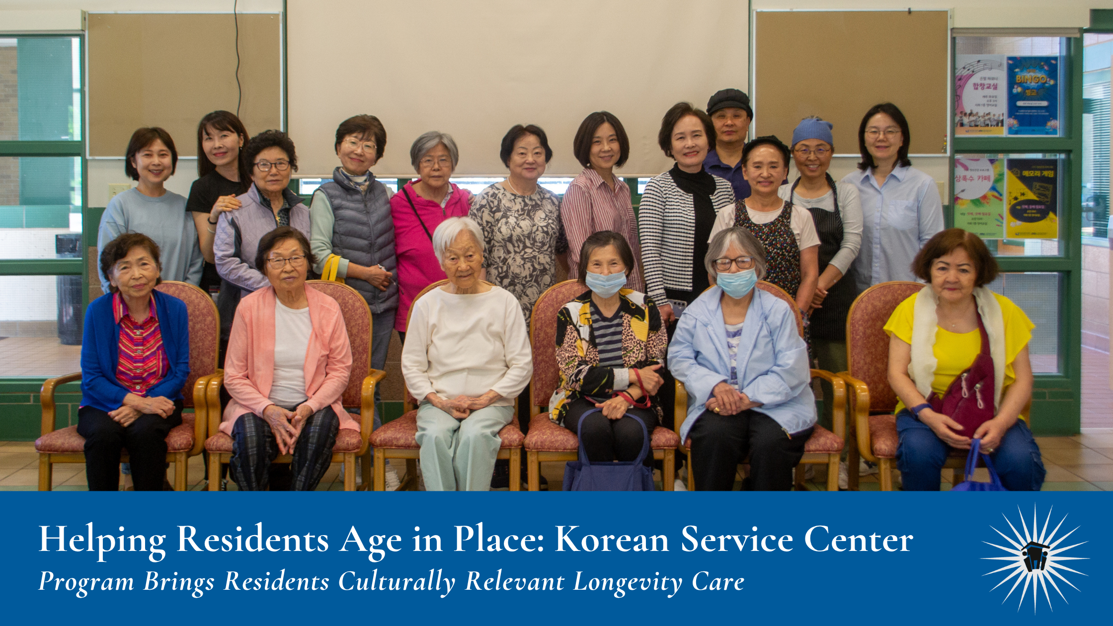 A group of adults pose together indoors at the Korean Service Center.